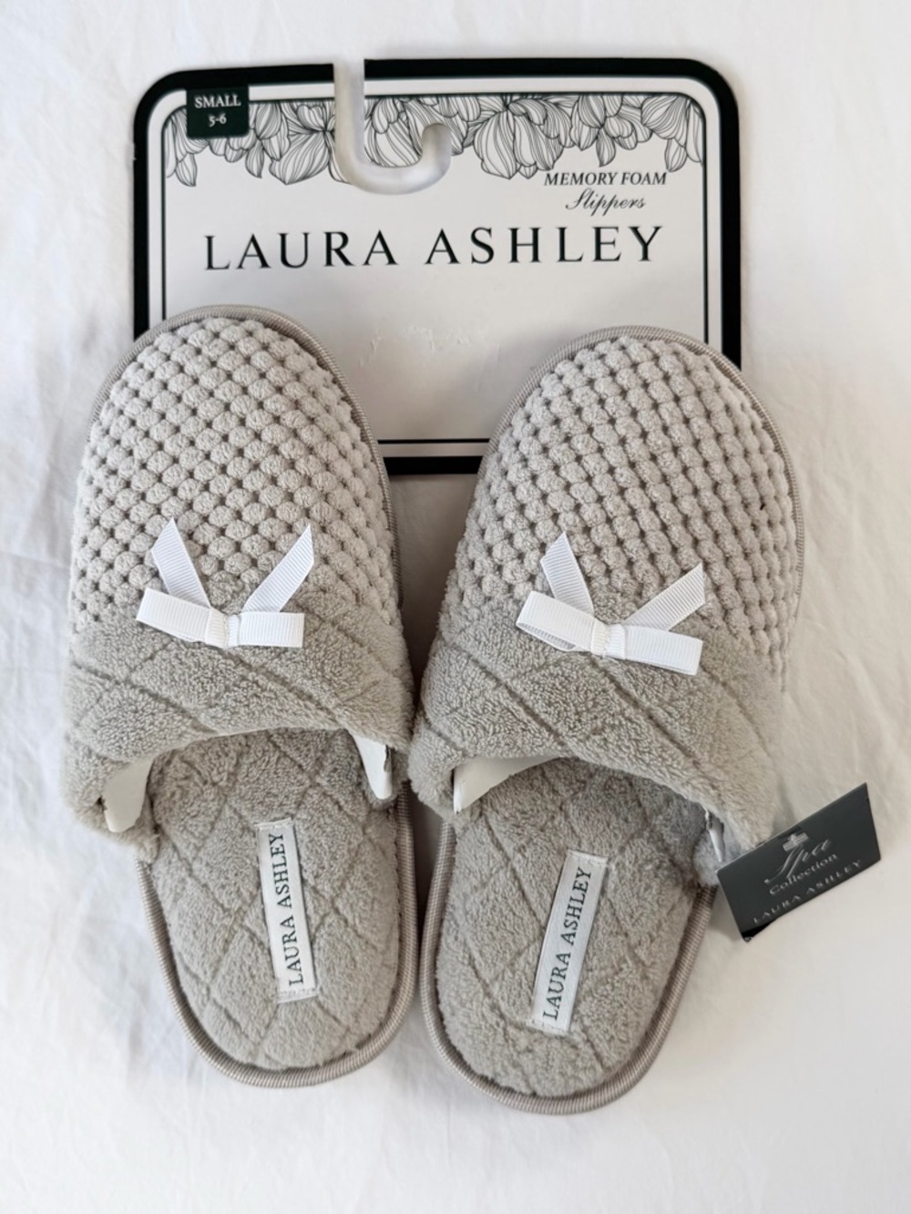 Laura Ashley Light Gray Quilted Memory Foam Slip-On Slippers with White Bows